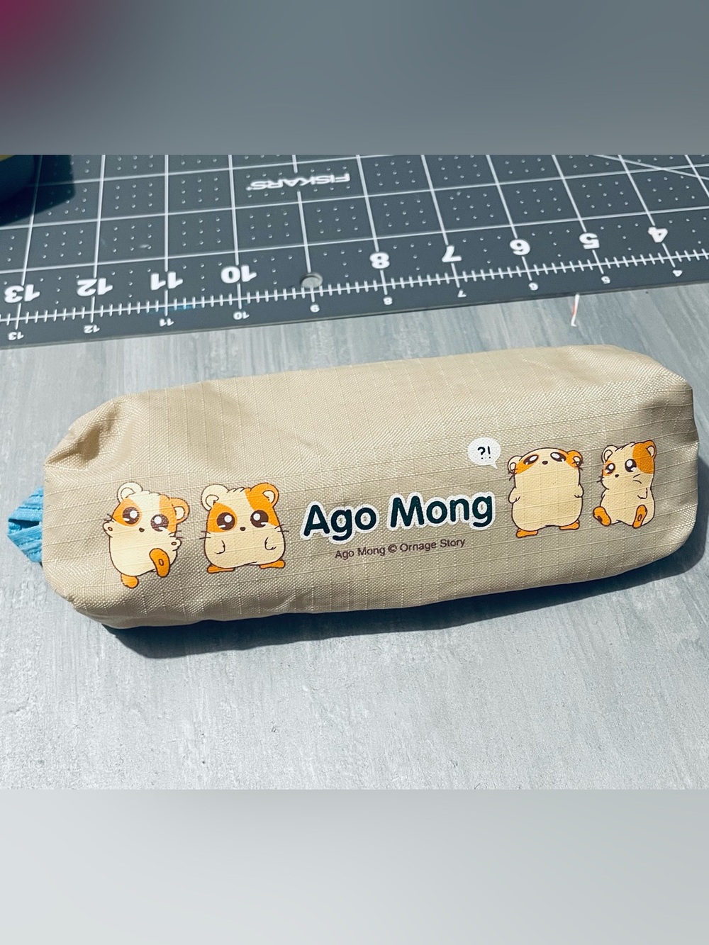 Ago Mong Beige Pencil Case with Orange and Blue Accents
